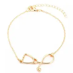 GENERICO - Pulsera estetoscopio dorada medicina