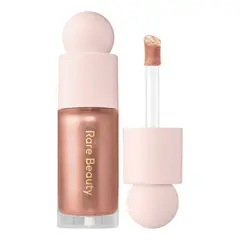 RARE BEAUTY - Iluminador Líquido Positive Light en Transcend 7ml