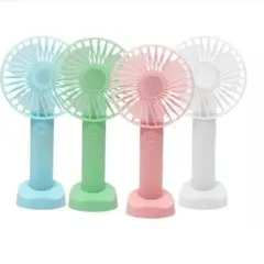 GENERICO - VENTILADOR DE MANO RECARGABLE SOPORTE BASE CELULAR COLORES