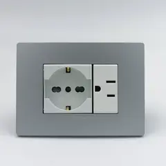 SINTHESI - TOMACORRIENTE DOBLE 1 SCHUKO Y 1 AMERICANO S33 PLACA PLATA
