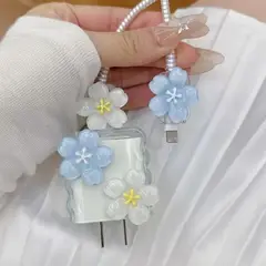 GENERICO - CASE PROTECTOR DE CARGADOR DE IPHONE DE FLORES HAWAIANAS CELESTE