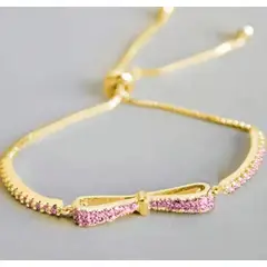MORITA BAG STORE - PULSERA DE PIEDRAS DE CIRCONIO COLOR ROSADO AJUSTABLE DISEÑO LAZO
