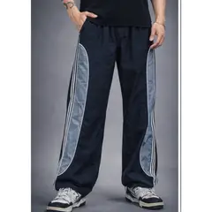 ENKI - Pantalón Power Track Oversized Tela Mojada Negro Hombre