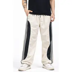 ENKI - Pantalón Power Track Oversized Tela Mojada Hueso Hombre