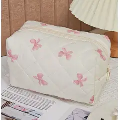 GENERICO - NECESER COSMETIQUERO DE VIAJE CREMA CON LAZOS ROSADOS ORGANIZADOR DE MAQUILLAJE ELEGANTE, COMPACTO Y PRACTICO